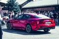 Moscow / Russia Ã¢â¬â 08 31 2018: Red car Kia Stinger with showgirl on automotive Royalty Free Stock Photo